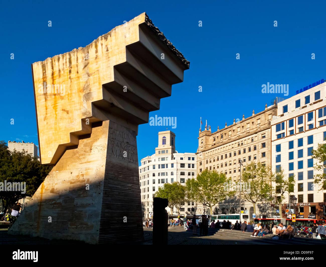 Plaça de Catalunya or Plaza de Cataluña in central Barcelona Catalonia Spain with the Francesc Macià monument in foreground Stock Photo