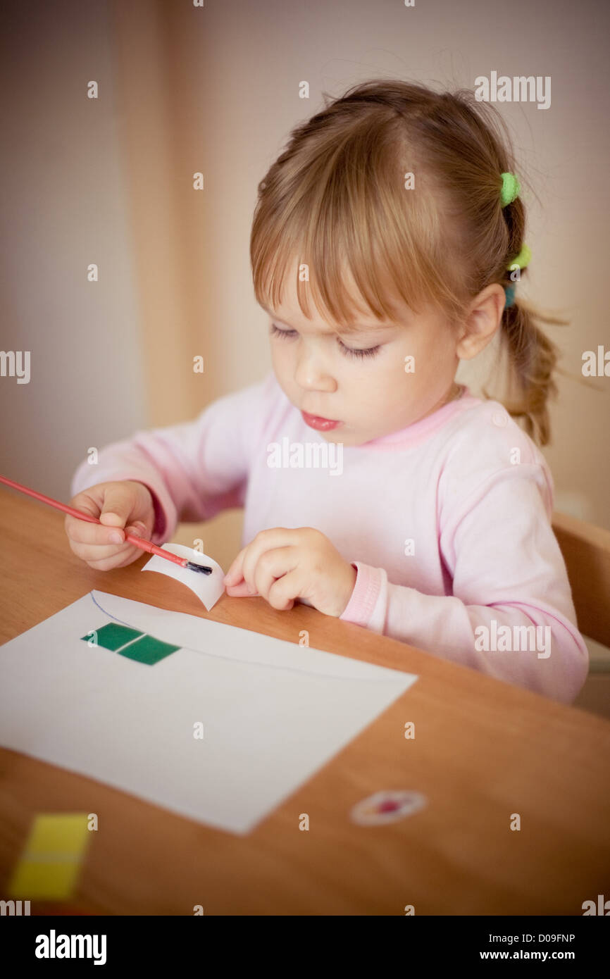 Child on creative lesson making an application Stock Photo - Alamy