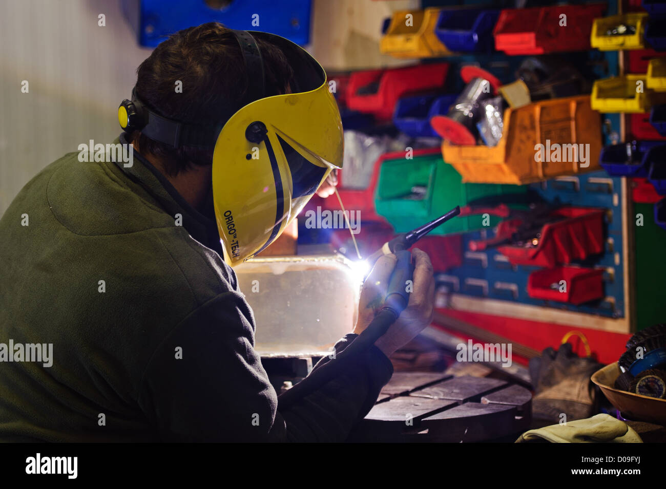 Man aluminium welding Stock Photo