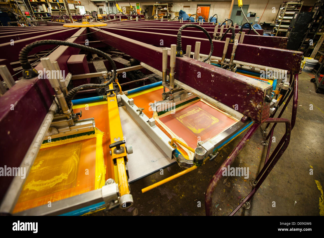 Semi-automatic silk screen printing machinery in a print shop Stock - Alamy