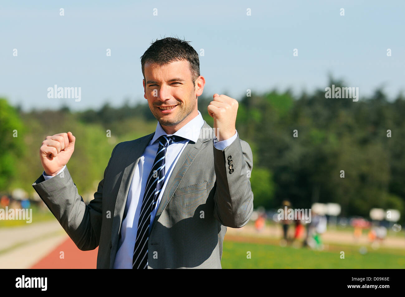 Portrait of a businessman outdoor with winner spirit Stock Photo - Alamy