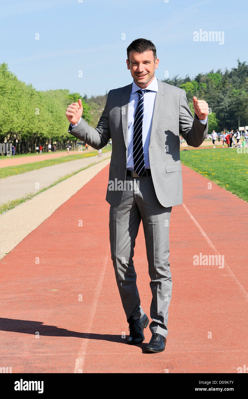 Portrait of a businessman outdoor with winner spirit Stock Photo - Alamy