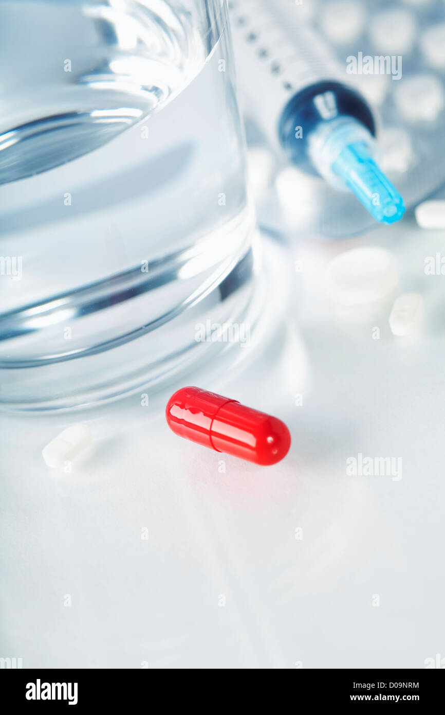 Glass of Water, Syringe and Pills (with sample text) Stock Photo