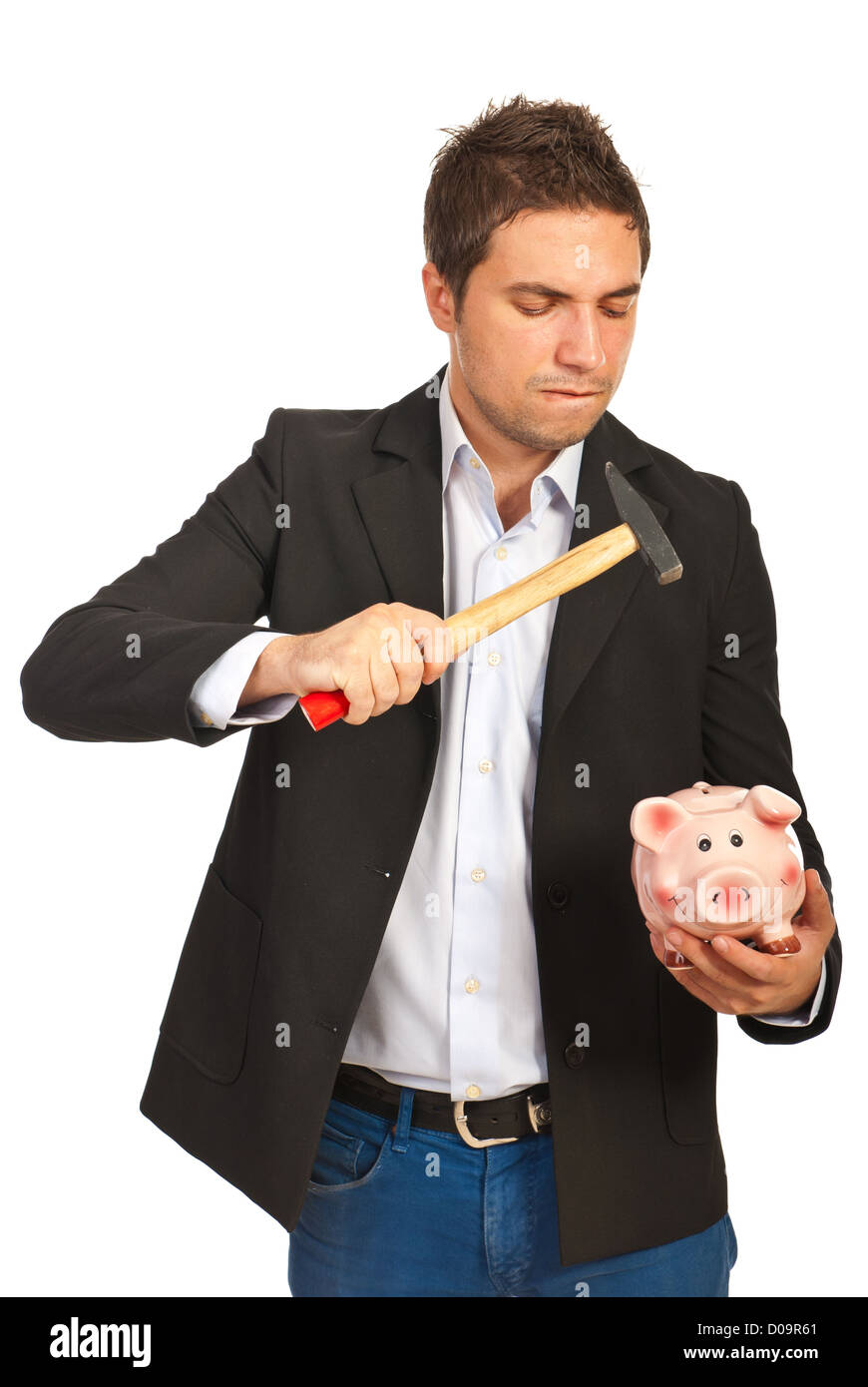 Furious business man broke a piggy bank with a hammer isolated on white ...