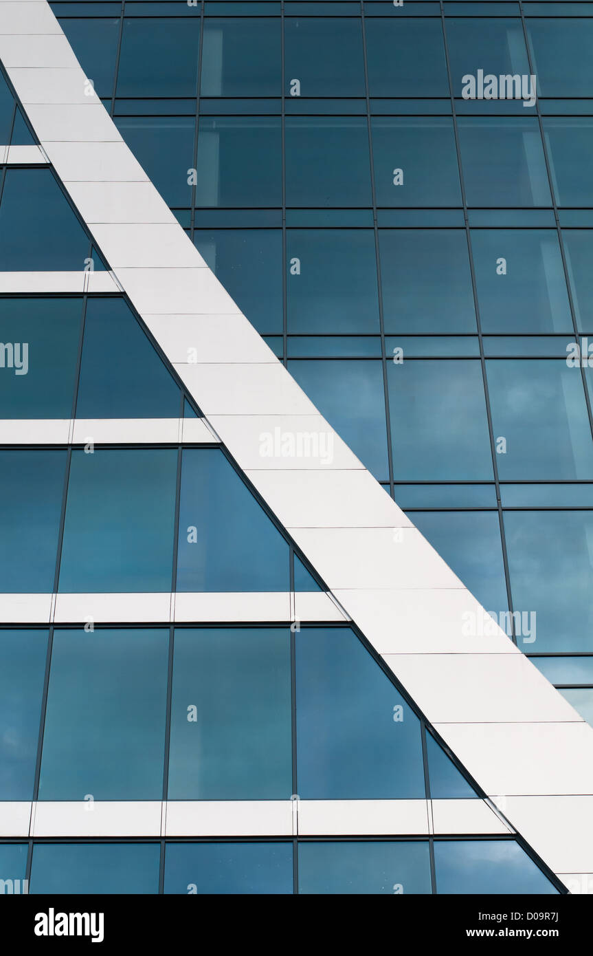 Blue sky reflected in the windows of office building Stock Photo - Alamy