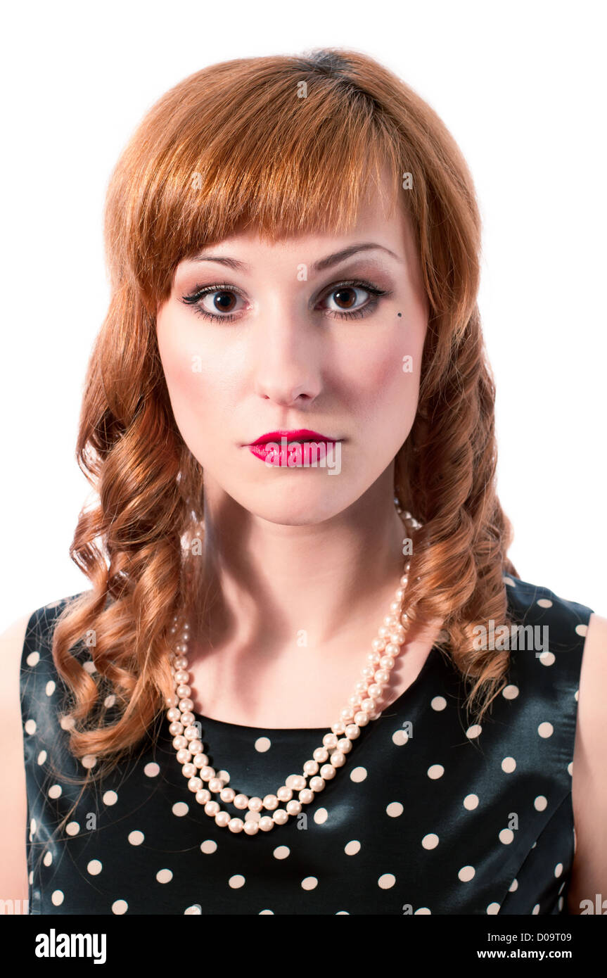 Retro girl with pearl necklace smiling Stock Photo