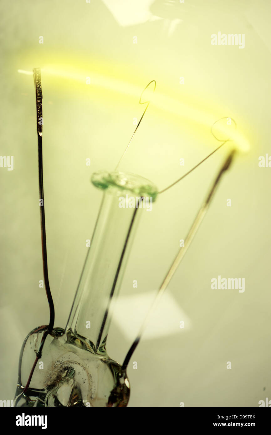 Macro view of a glowing yellow incandescent light bulb Stock Photo Alamy