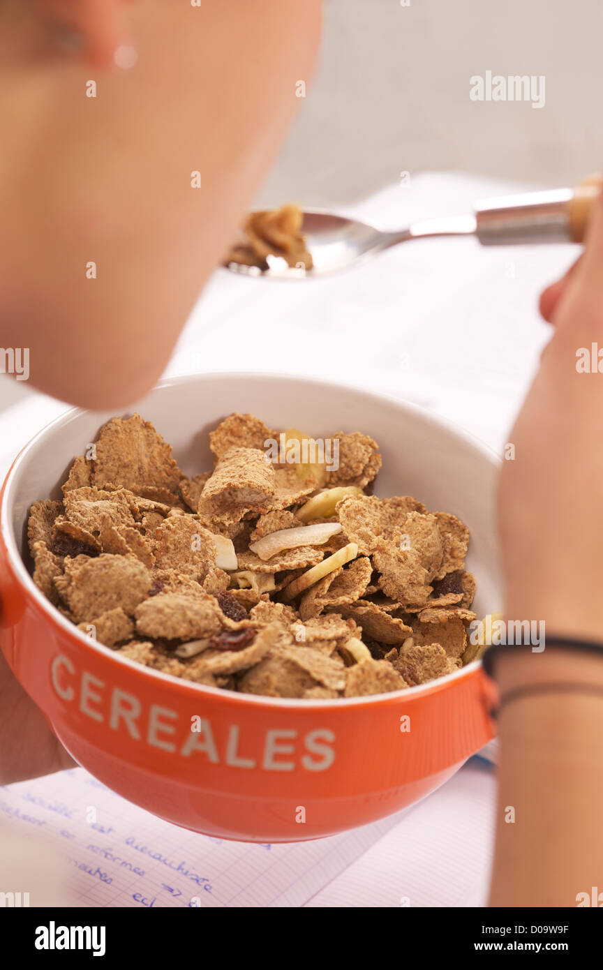 ADOLESCENT EATING BREAKFAST Stock Photo - Alamy