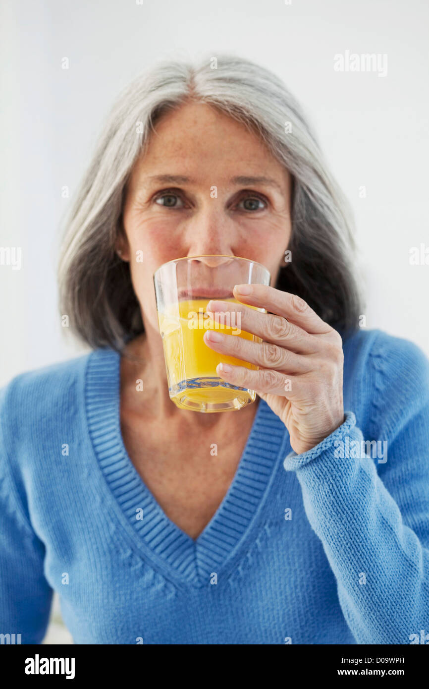ELDERLY PERSON WITH COLD DRINK Stock Photo Alamy