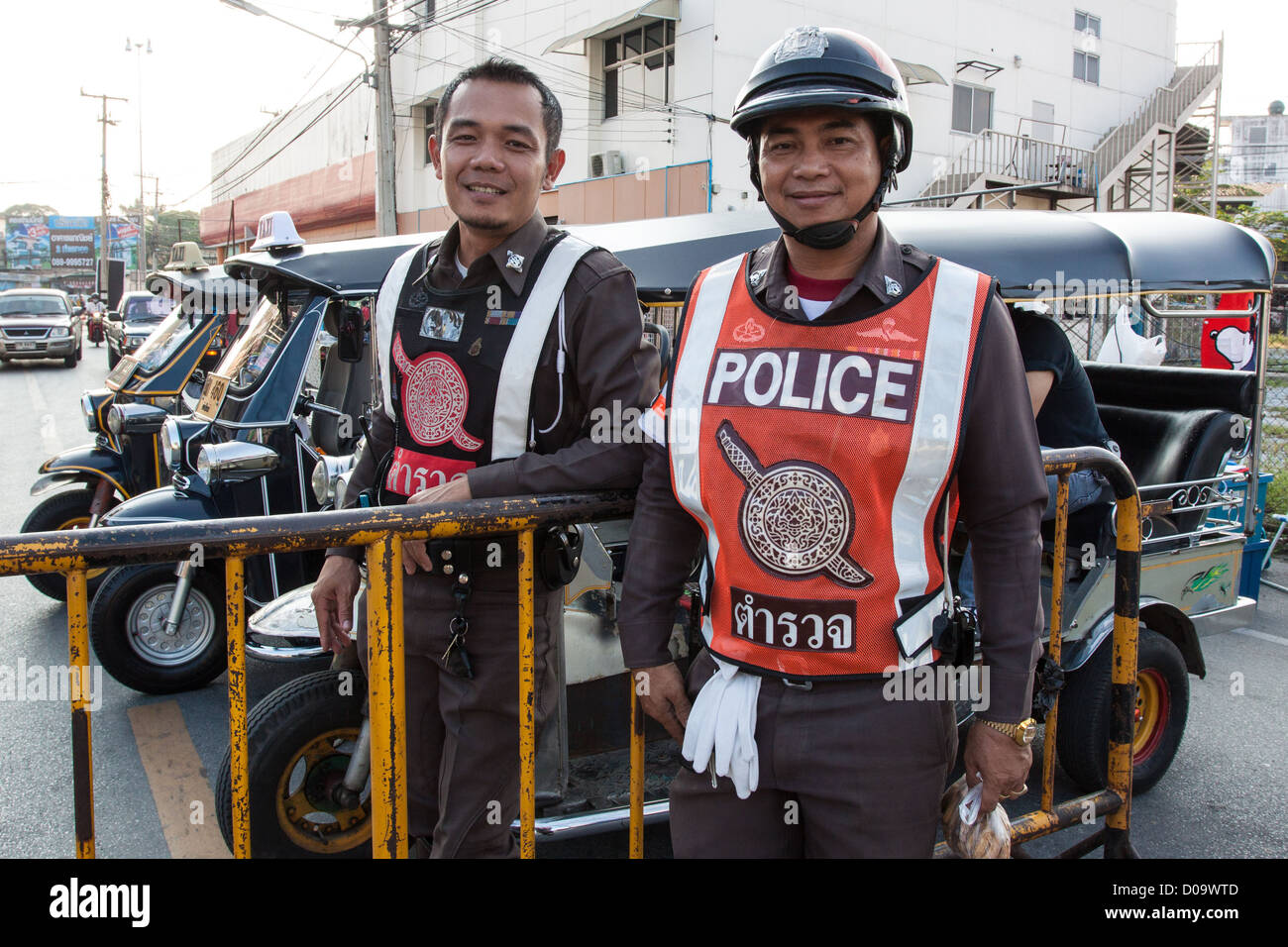 PORTRAIT OF THAI POLICE OFFICERS PROUDLY POSING ON A STREET IN CHIANG MAI THAILAND ASIA Stock Photo