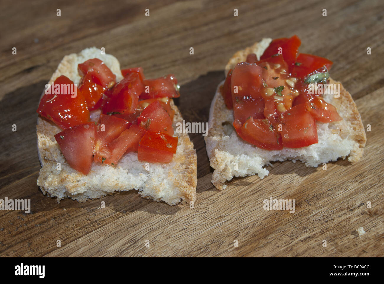 toasted bread seasoned with oil and garlic and often diced tomatoes