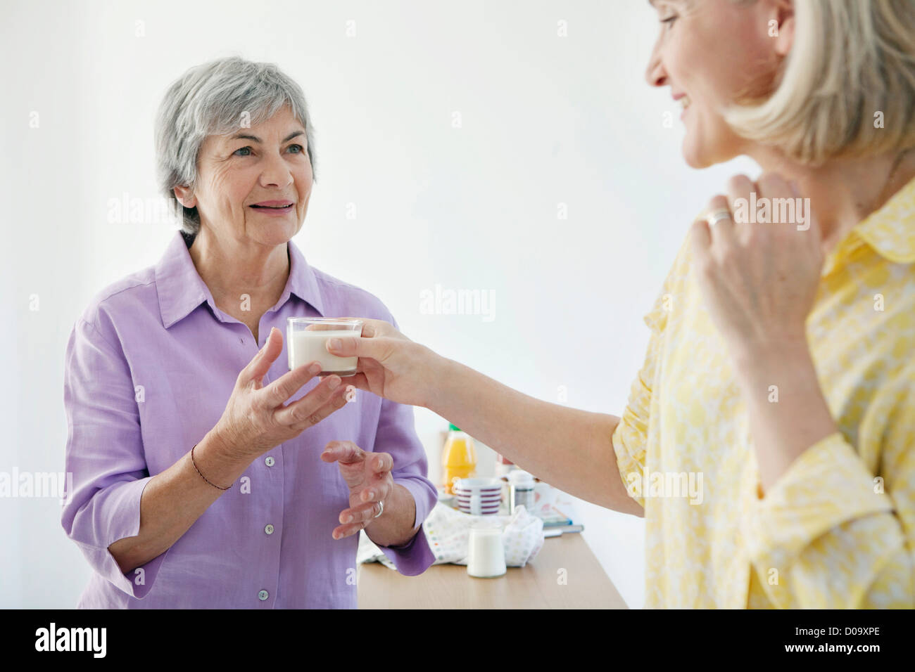 ELDERLY PERSON, DAIRY PRODUCT Stock Photo
