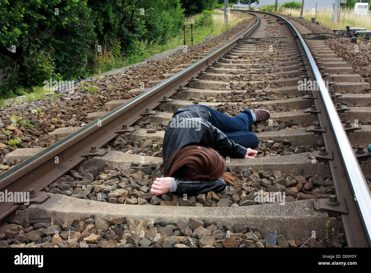 ILLUSTRATION SUICIDE YOUNG WOMAN ON THE RAILWAY TRACKS BRIDES-LES-BAINS (73) SAVOY FRANCE Stock Photo