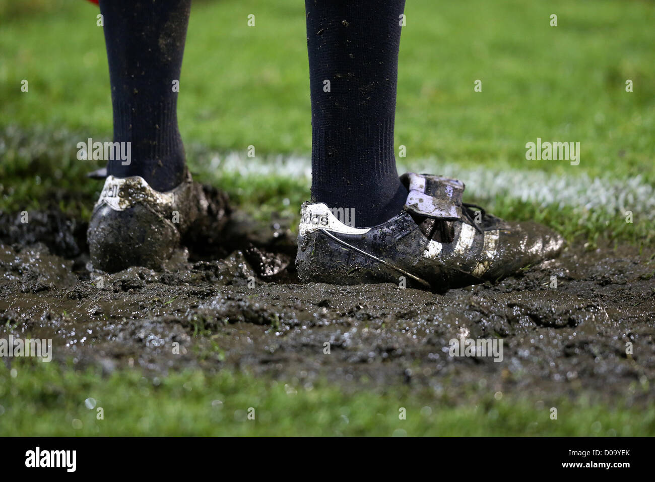 Muddy Adidas football boots. Stock Photo