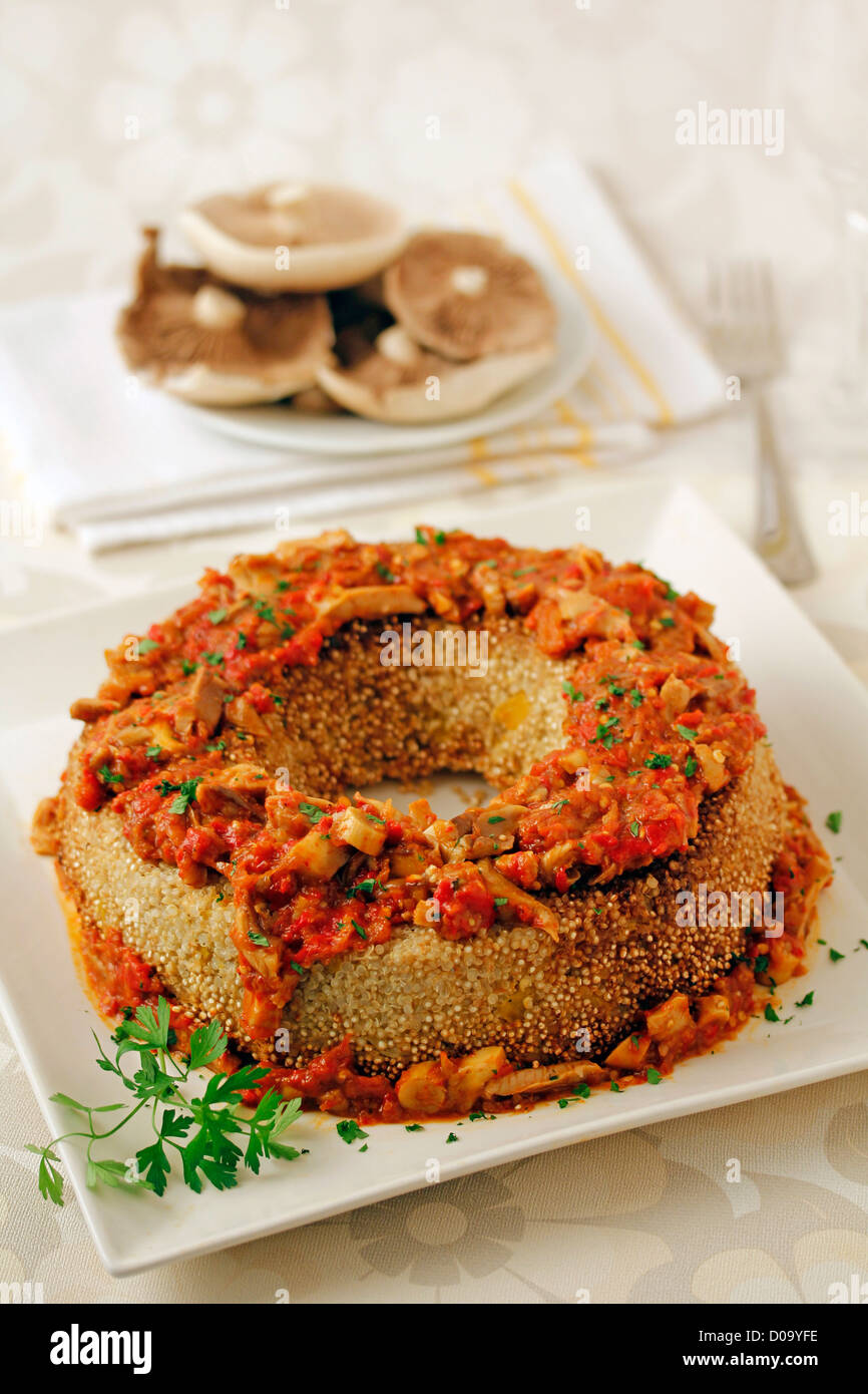 Quinoa crown with mushrooms. Recipe available. Stock Photo