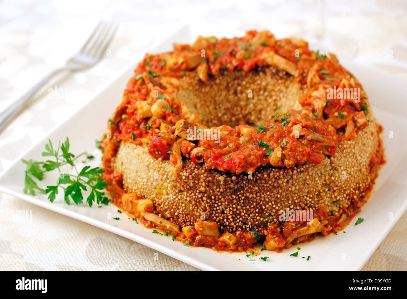 Quinoa crown with mushrooms. Recipe available. Stock Photo