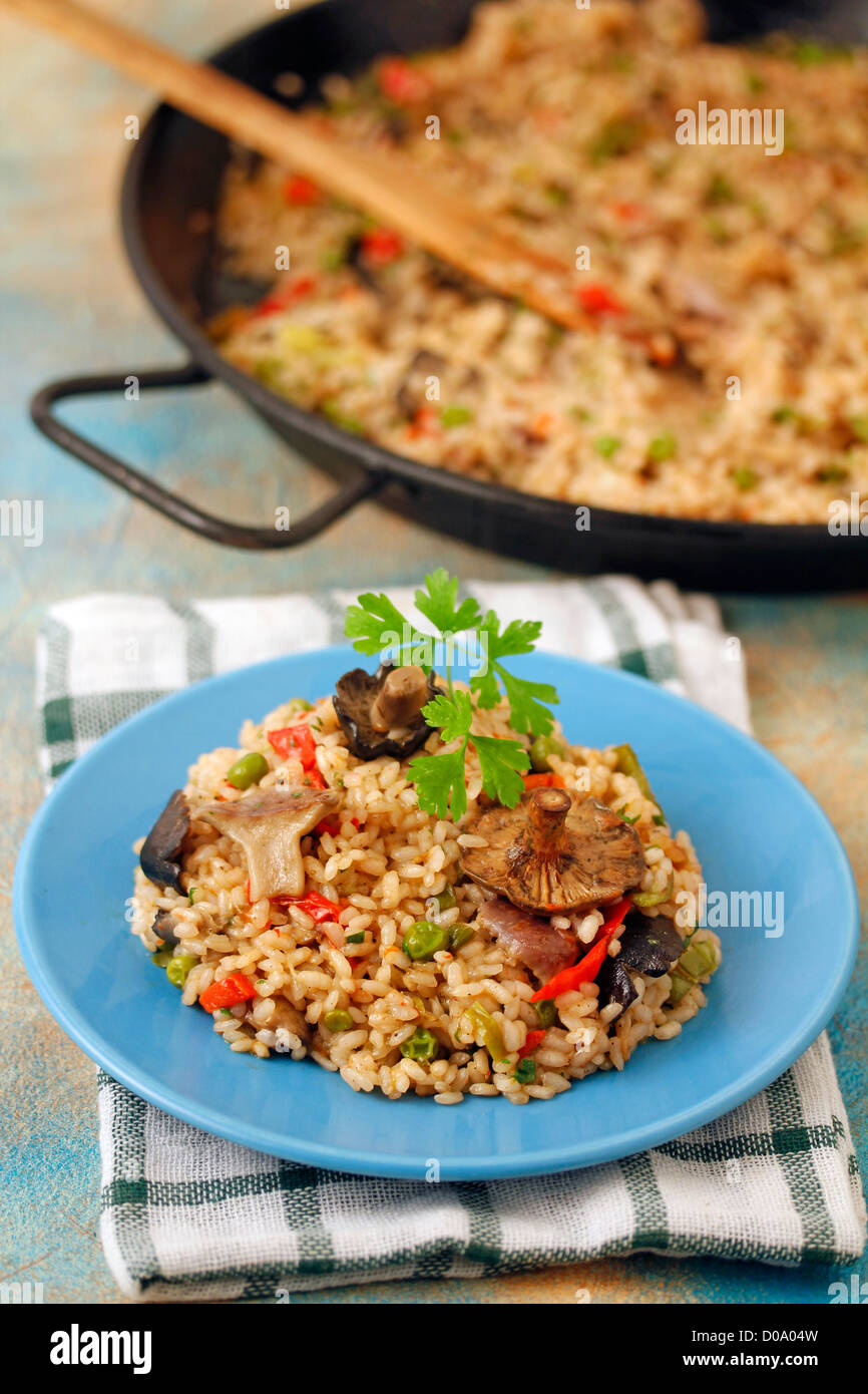 Paella with wild mushrooms. Recipe available. Stock Photo