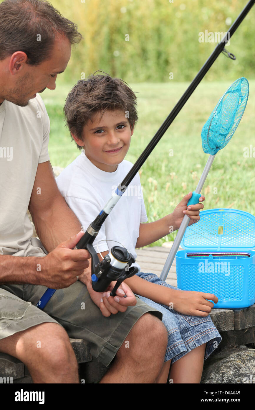 Father and son fishing together Stock Photo