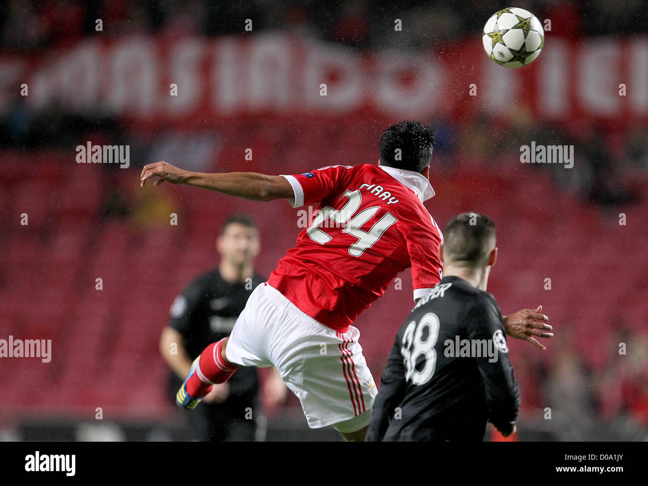 Lisbon, Portugal. 20th November 2012. Benfica's defense Ezequiel Garay wins the the ball during the group G UEFA Champions League  football match between Benfica and Celtic at Luz Stadium in Lisbon on November 20, 2012.   Photo / Carlos Rodrigues (Photo credit should read Carlos Rodrigues ). Stock Photo