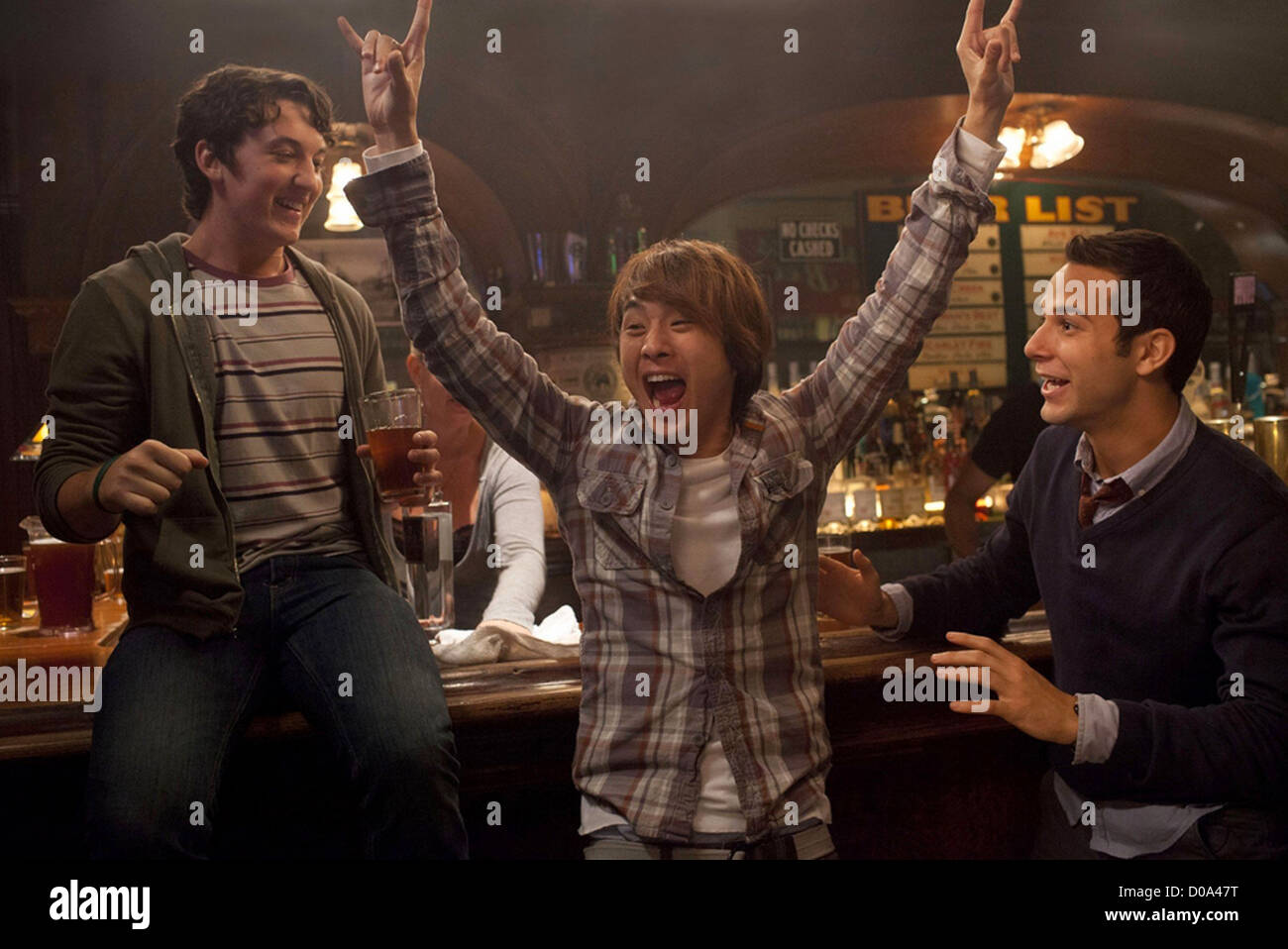 21 AND OVER - 2013 Relativity Media film with from l: Miles Teller, Justin Chon and Skylar Astin Stock Photo