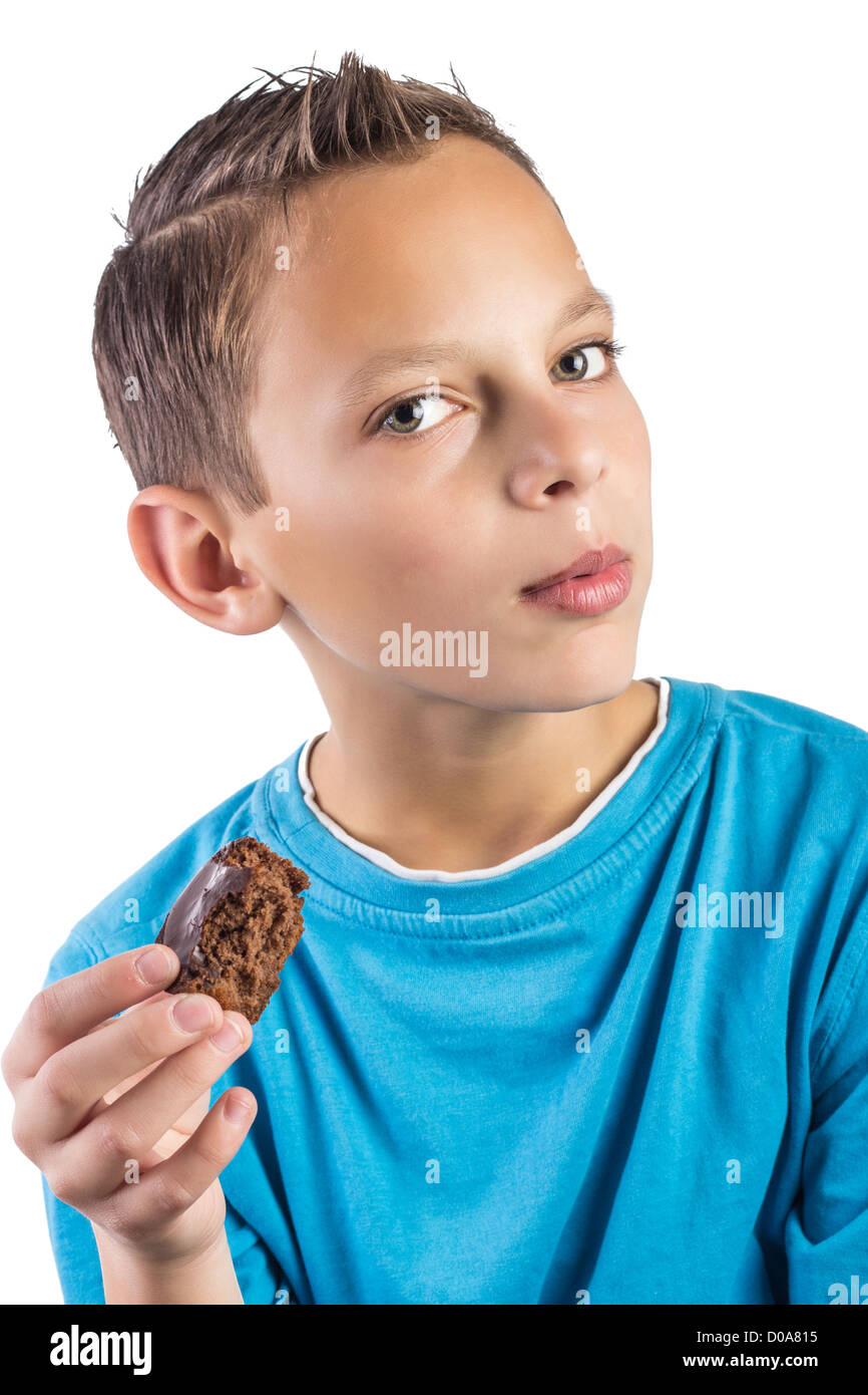Close up of Adorable boy eating cookies Stock Photo