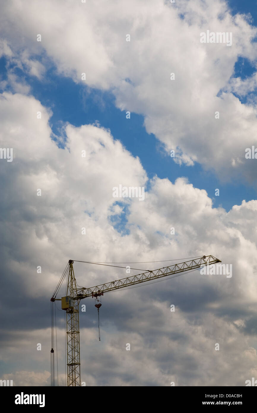Construction crane over cloudy sky Stock Photo - Alamy