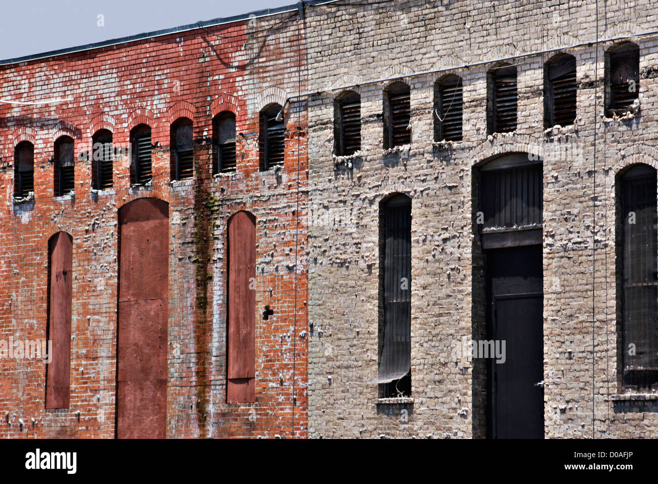 Wall of an old house with windows Stock Photo - Alamy