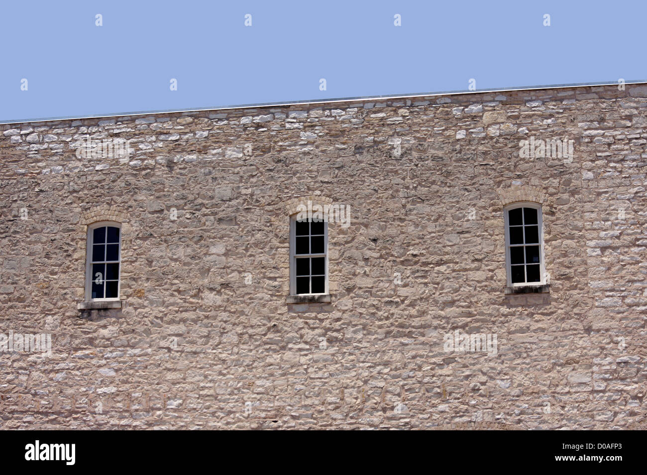Wall of an old house with windows Stock Photo - Alamy