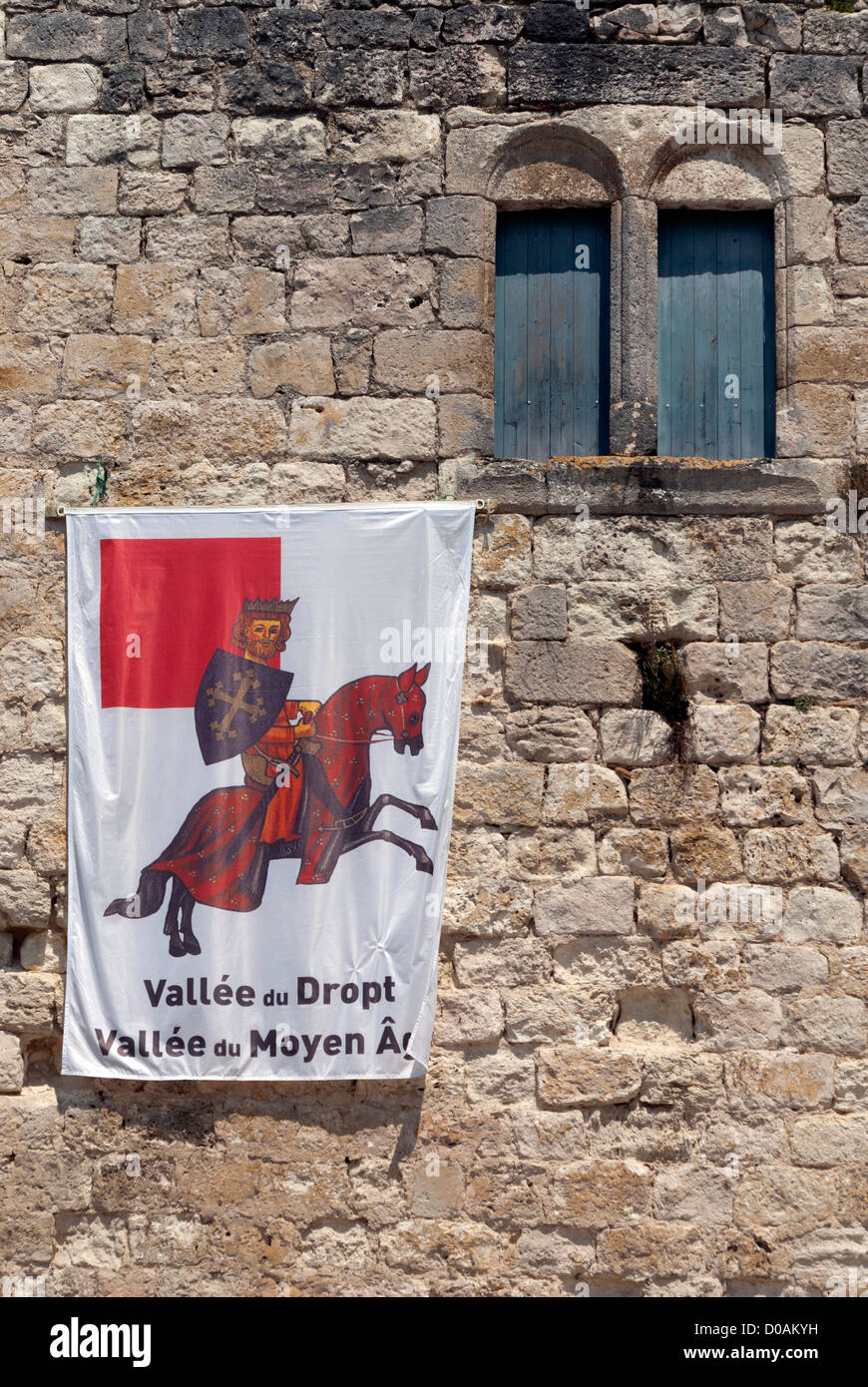 Flag on the wall of the Tour Monseigneur, part of the Chateau de la Bastide in Eymet, Dordogne Stock Photo