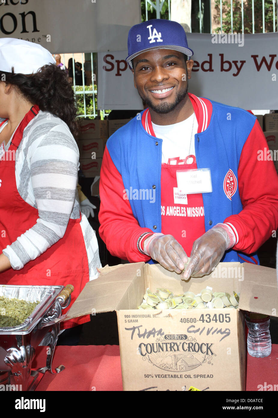 Kel Mitchell Anne and Kirk Douglas Center host a Thanksgiving Meal the Homeless held at the Los Angeles Mission. Los Stock Photo
