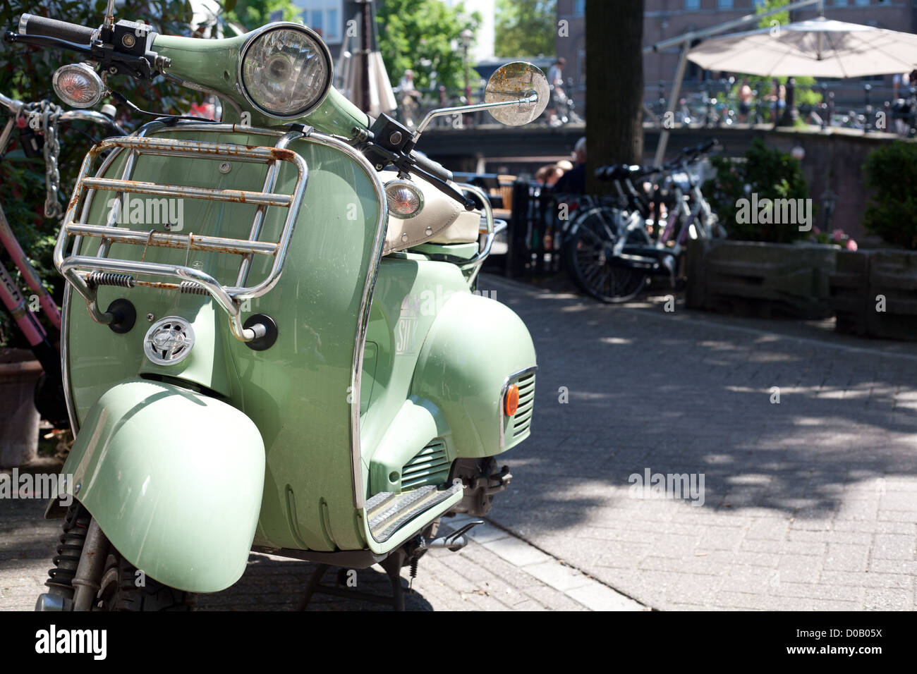 Vespa parked on the sidewalk in Amsterdam Stock Photo