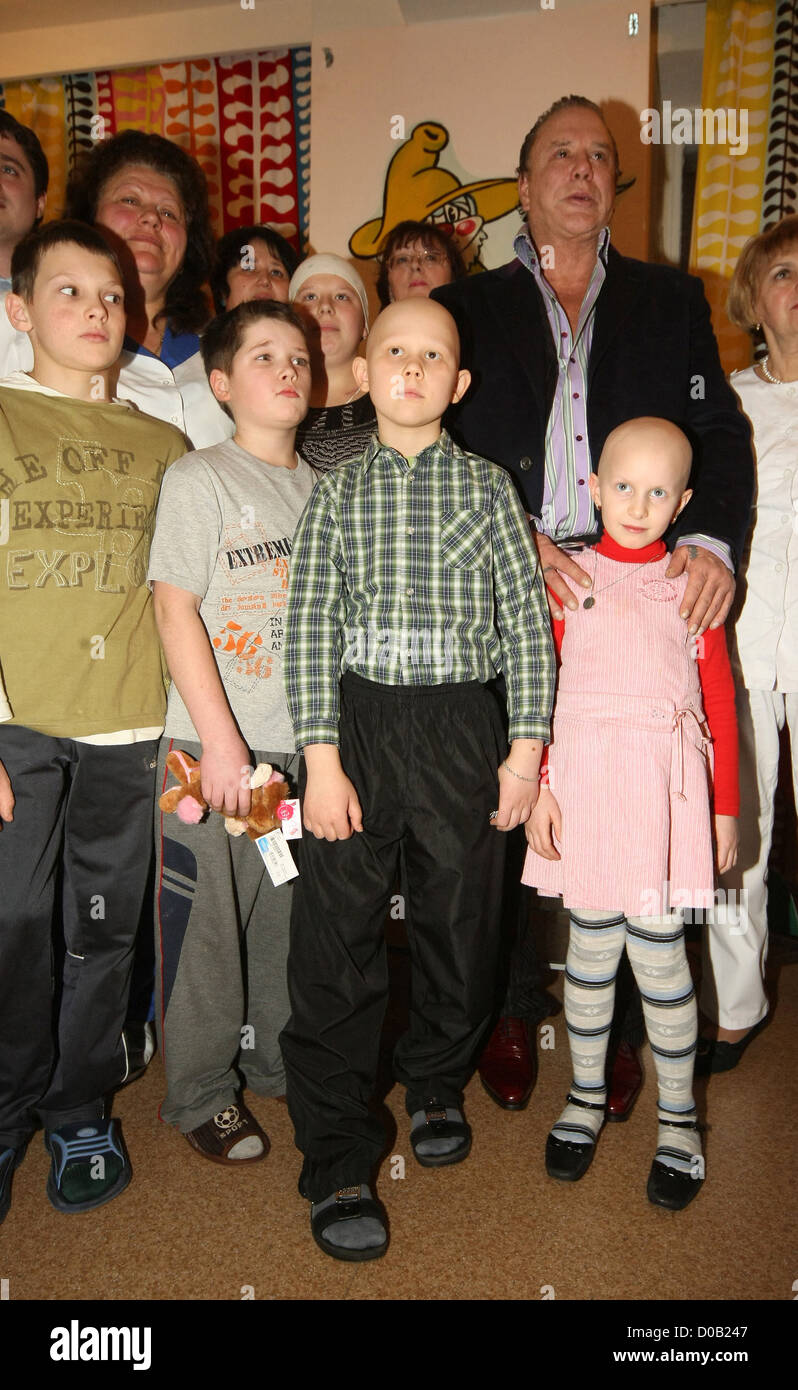 M Rourke Children Mickey Rourke hands out gifts during his visit to a children's hospital ...