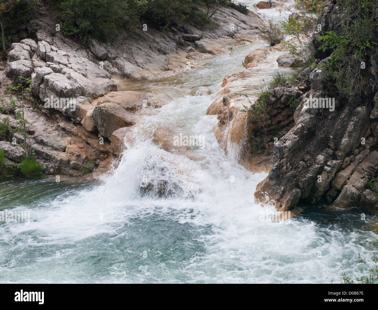 Hiking in Sierrra de Cazorla nature reserve in Andalusia Spain, view of waterfall over cliffs in the Rio Borosa river Stock Photo