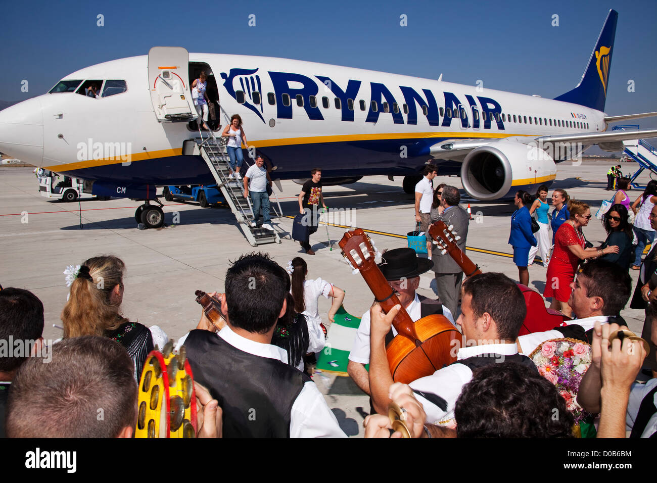 Tourists getting off a plane at Malaga airport Costa del Sol Andalusia Spain Stock Photo