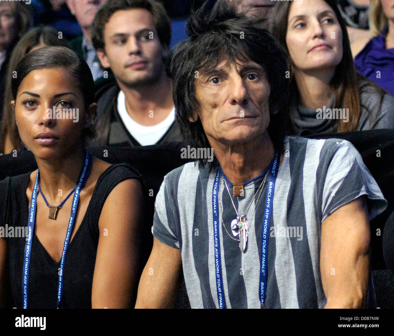 Rolling Stone Ronnie Wood and his girlfriend Ana Araujo watch the singles final on the last day of the ATP World Tour Finals at Stock Photo