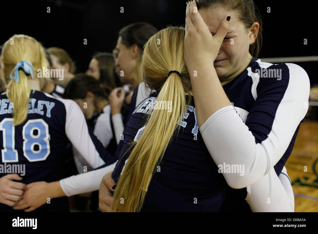 Nov. 17, 2012 - Kissimme, Florida, U.S. - Berkeley volleyball player Addison Harden (9) hugs her teammate Logan Weldon (2) after loosing three straight sets against Bishop Moore at the Silver Spurs Arena in Kissimmee on Saturday afternoon. (Credit Image: © Eve Edelheit/Tampa Bay Times/ZUMAPRESS.com) Stock Photo