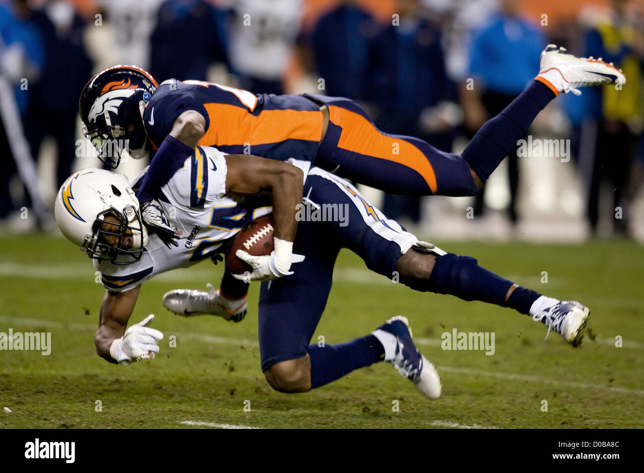 Nov. 18, 2012 - Denver, Colorado, U.S. - Chargers WR DANARIO ALEXANDER, bottom, grabs a pass against Broncos CB CHAMP BAILEY, top during the 4th quarter at Sports Authority Field at Mile High Sunday afternoon. Broncos beat the Chargers 30-23. (Credit Image: © Hector Acevedo/ZUMAPRESS.com) Stock Photo