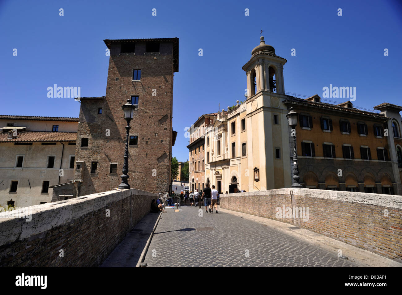 italy, rome, isola tiberina, ponte fabricio, ancient roman bridge and torre dei caetani Stock Photo