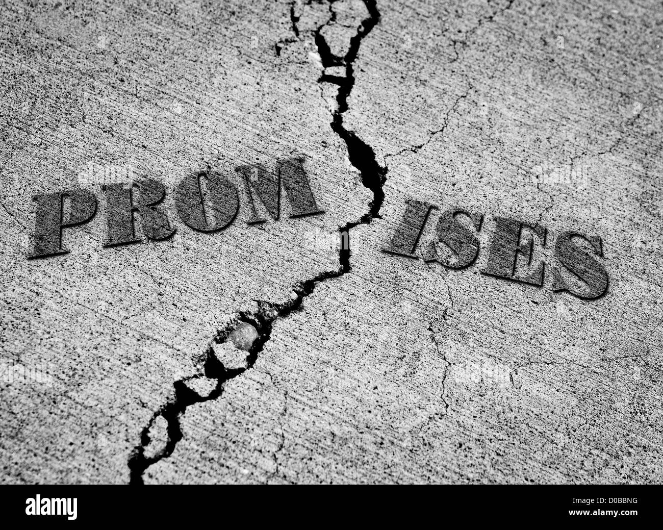 Broken promises with crack in concrete with words Stock Photo