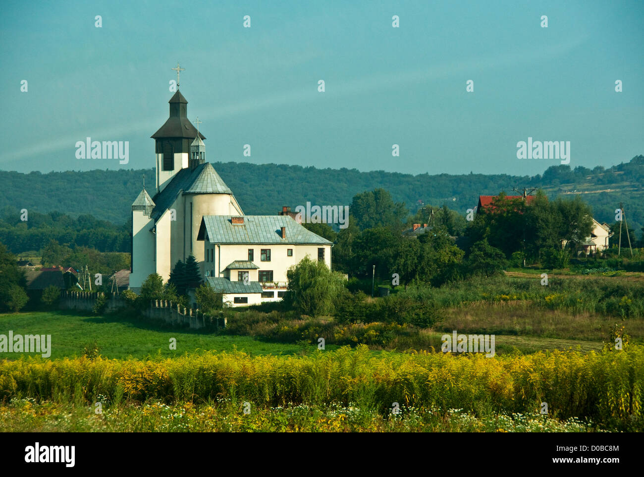 Countryside church and farm scenic west of Krakow Stock Photo