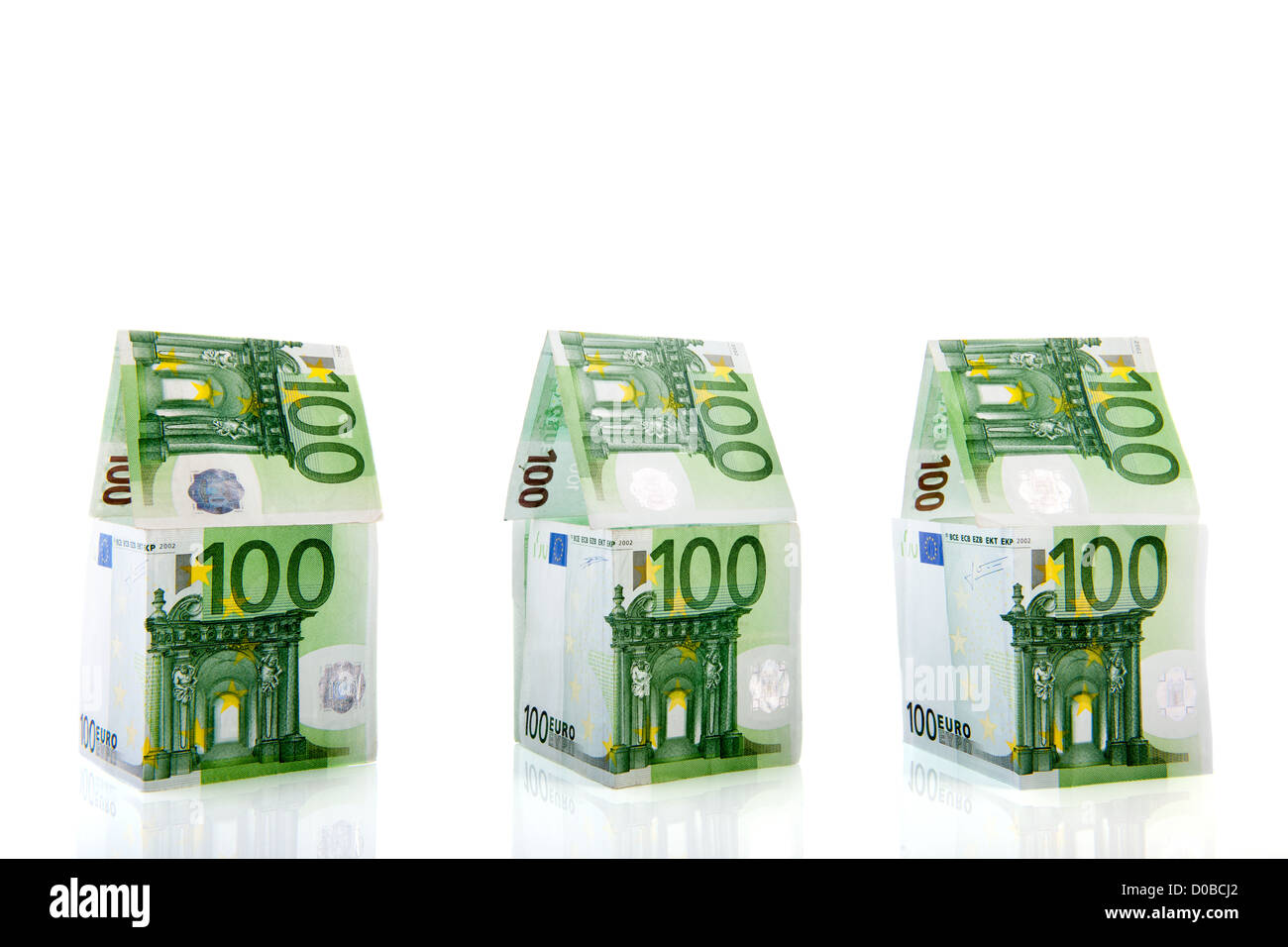 Row green and orange money houses from European banknotes Stock Photo