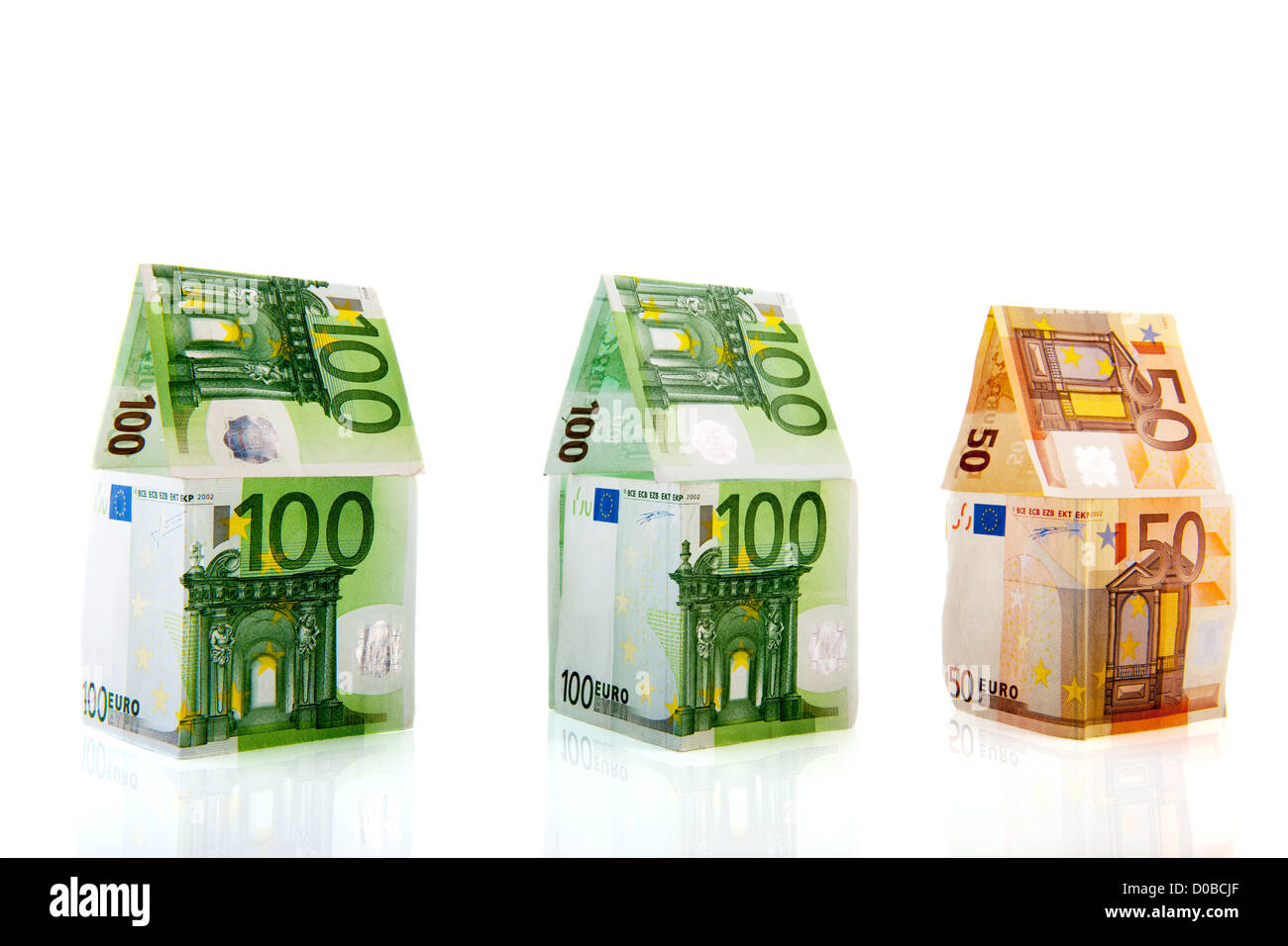 Row green and orange money houses from European banknotes Stock Photo