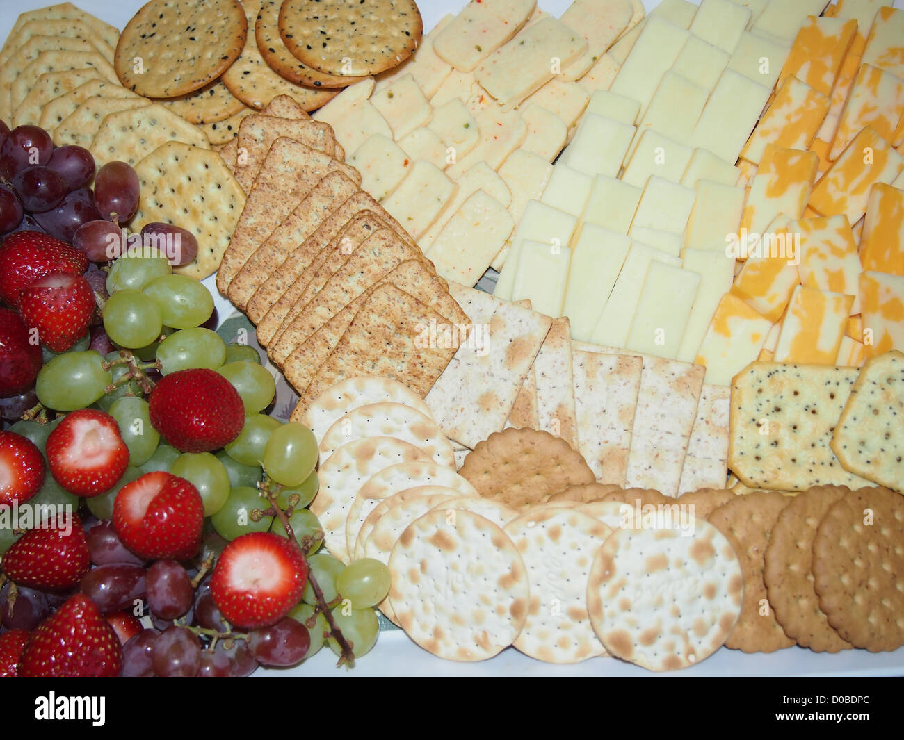 Close up cheese cracker and fruit tray Stock Photo - Alamy
