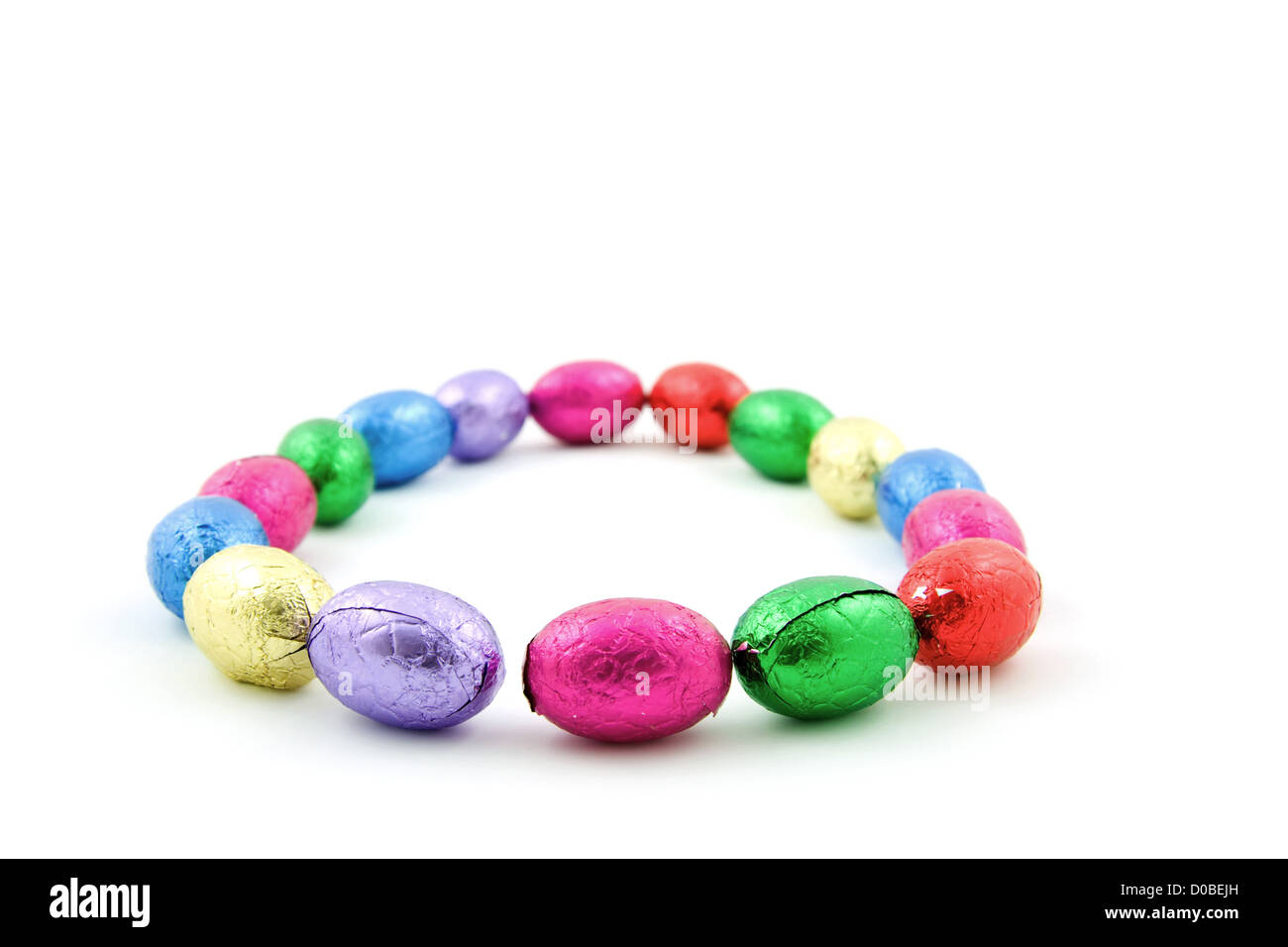 colorful chocolate easter eggs in a circle isoalated on white ...