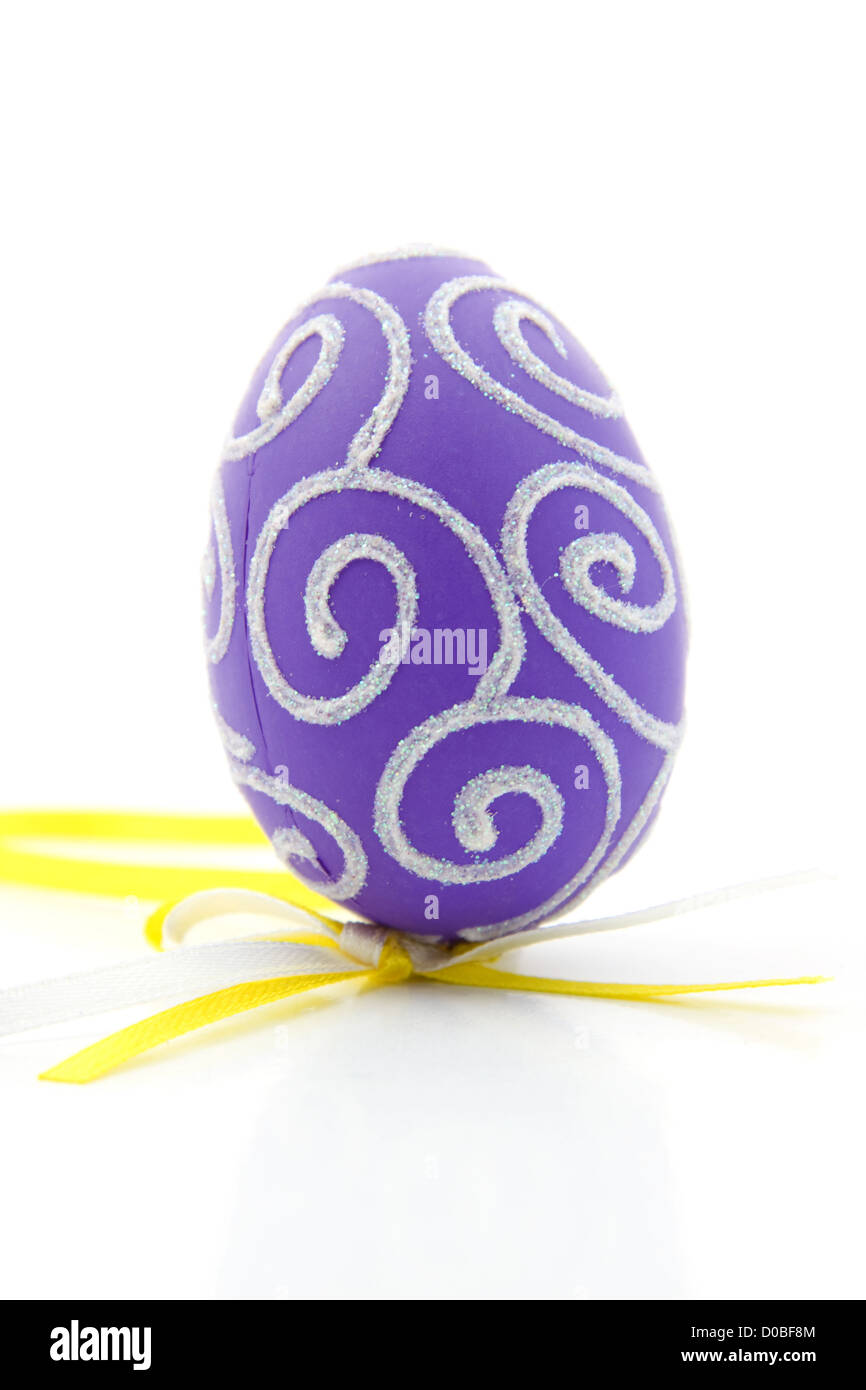 One purple easter egg, isolated on white background Stock Photo - Alamy