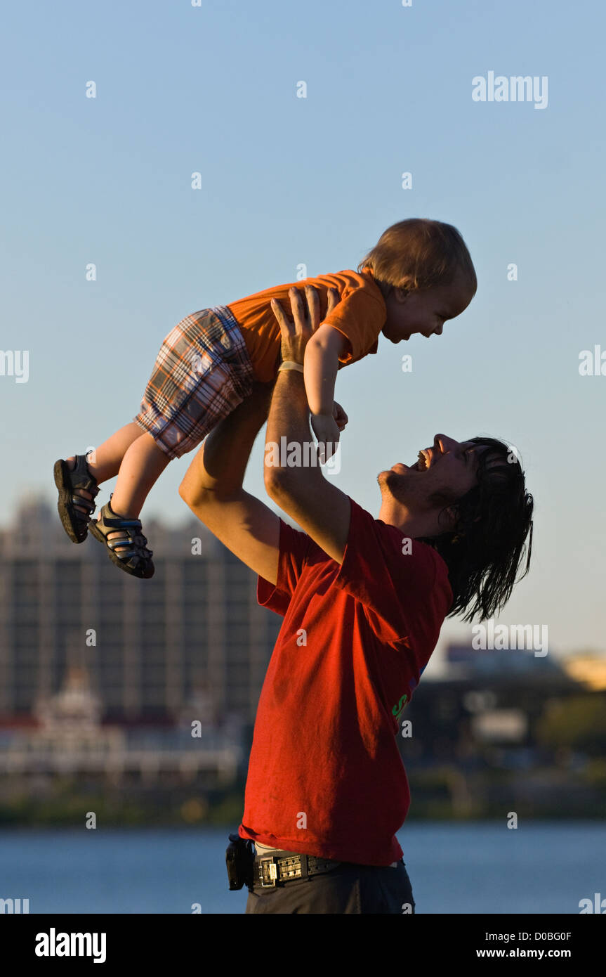 Father Playing with Young Son on the Great Lawn at Waterfront Park in Louisville, Kentucky Stock Photo