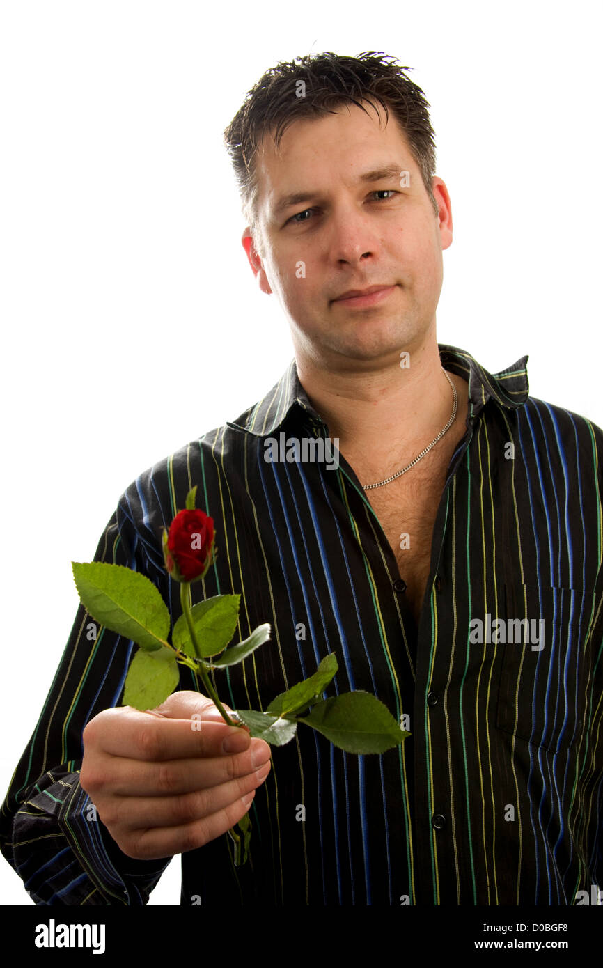 Handsome man gives a rose, isolated on white background Stock Photo - Alamy