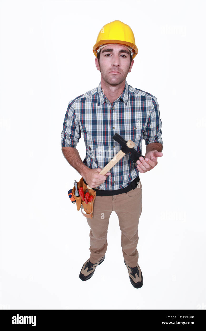 craftsman holding hammer looking threatening Stock Photo