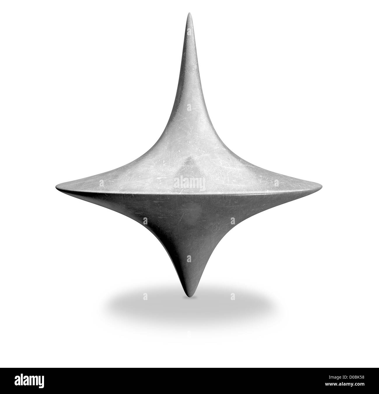 A slightly scratched die-cast lead spinning top in an upright position on an isolated background Stock Photo
