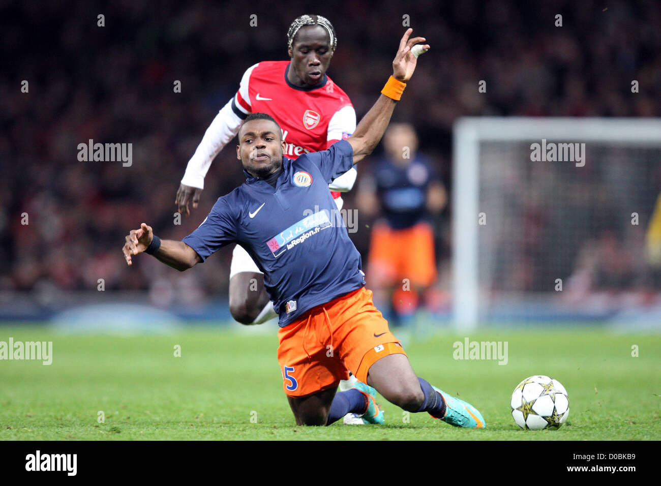 21.11.2012 London, England.  Bacary Sagna of Arsenal and Henri Bedimo of Montpellier HSC in action during the Champions League Group B game between Arsenal and Montpellier HSC from Emirates Stadium. Stock Photo